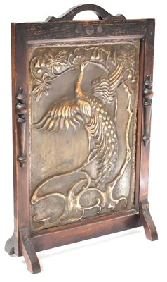 Lot 55 - An Arts & Crafts pressed metal fire screen...