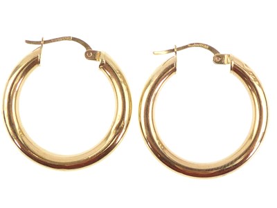 Lot 1042 - A pair of 9ct gold hoop earrings, diameter...