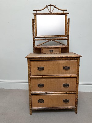 Lot 96 - A bamboo dressing table with three drawers and...