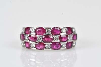 Lot 413 - A diamond and ruby twenty-seven stone broad...