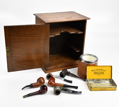 Lot 505 - An oak smoker's cabinet, with pipes and...
