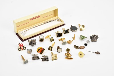 Lot 562 - A collection of cufflinks and badges, with a...