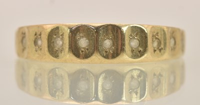 Lot 1287 - A 9ct yellow gold half hoop ring set with...