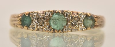 Lot 1293 - A 9ct yellow gold emerald and white stone set...