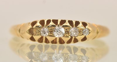 Lot 1264 - An 18ct white gold five stone diamond set ring...