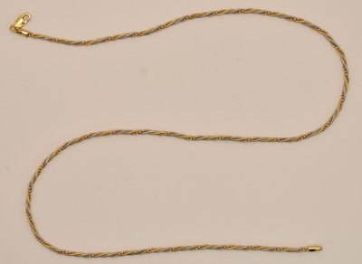 Lot 1311 - An 18ct two-tone gold twist necklace with...