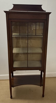 Lot 869 - An Edwardian display cabinet with undertier,...