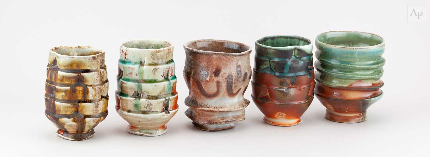 Lot 38 - BEN BATES; a group of five ribbed wood fired...