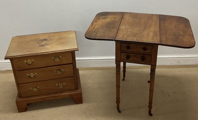 Lot 866 - An elm drop-leaf table with two drawers to the...