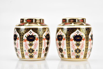Lot 1317 - ROYAL CROWN DERBY; a pair of lidded ginger...
