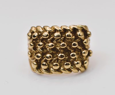 Lot 545 - A 9ct yellow gold knot ring, size N, 7.16g.