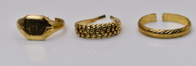 Lot 537 - Three cut 9ct yellow gold rings, 7.23g
