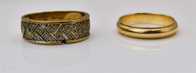 Lot 549 - A 9ct yellow gold wedding band and a misshapen...