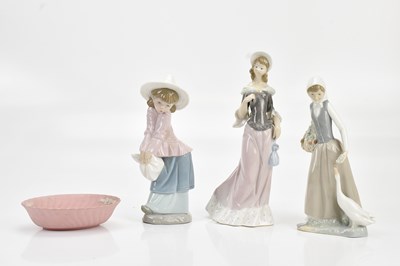 Lot 1299 - LLADRÓ; two figures, young girl with sunhat...
