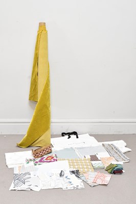 Lot 20 - Two bags of fabrics and a part roll of yellow...