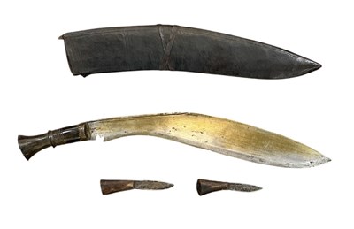 Lot 403 - A WWII period kukri in scabbard, with two...