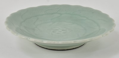 Lot 1008 - A Chinese celadon glazed porcelain dish with...