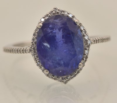 Lot 1203 - A 950 grade platinum natural oval cabochon cut...