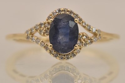 Lot 1219 - A 14ct yellow gold sapphire and diamond set...