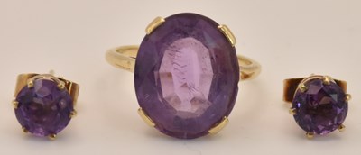 Lot 1265 - A 9ct yellow gold amethyst set dress ring, the...
