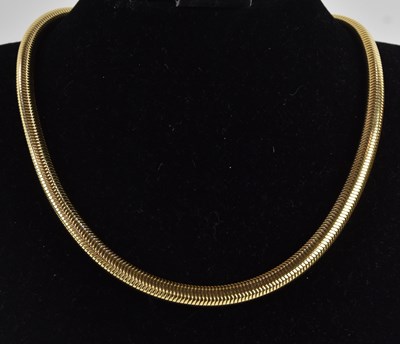 Lot 1296 - An 18ct yellow gold snake link reticulated...