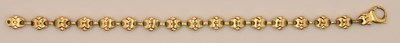 Lot 1396 - An 18ct yellow gold two-tone bow link bracelet,...