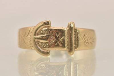 Lot 1295 - A 9ct rose gold buckle ring, size M, approx...