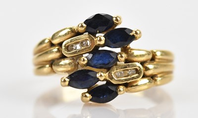 Lot 491 - A yellow metal diamond and sapphire dress ring,...