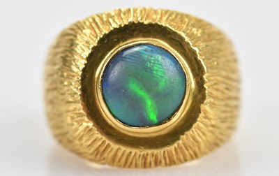 Lot 419 - A yellow metal textured opal set signet ring,...