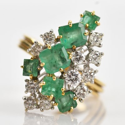 Lot 386 - An 18ct yellow gold diamond and emerald...