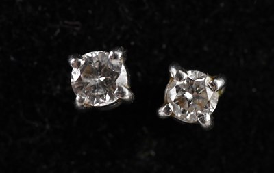 Lot 179 - A pair of 18ct white gold diamond ear studs,...