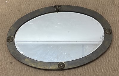 Lot 861 - An Art Nouveau oval wall mirror with a...