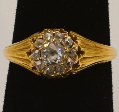 Lot 543 - A yellow metal and diamond cluster ring,...