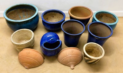 Lot 759 - A quantity of garden pots, both glazed and...