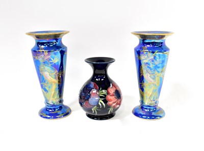 Lot 651 - MOORCROFT; a baluster vase, cobalt blue ground...