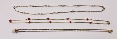 Lot 680 - Three yellow metal necklaces, to include a...