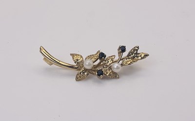 Lot 679 - A 9ct yellow gold blue topaz and seed pearl...