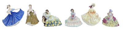 Lot 555 - ROYAL DOULTON; five porcelain figures...