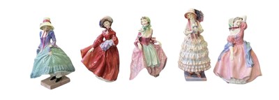 Lot 557 - ROYAL DOULTON; four boxed porcelain figures...