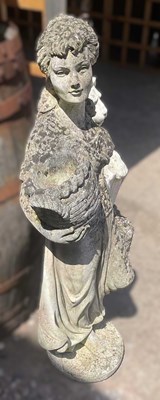 Lot 764 - A reconstituted concrete girl with basket,...