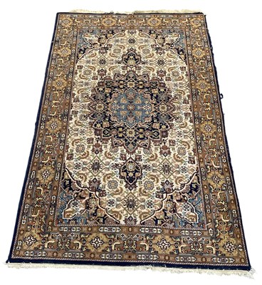 Lot 115 - A modern Indian hand woven woollen cream and...