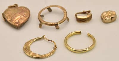 Lot 1186 - A group of scrap gold and yellow metal...