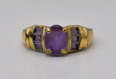 Lot 561 - A 9ct yellow gold amethyst dress ring, size M,...