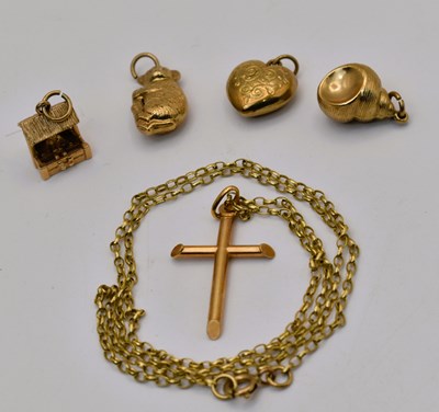 Lot 544 - Four 9ct yellow gold charms, together with a...