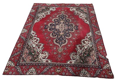 Lot 131 - A large modern red ground machine made Persian...