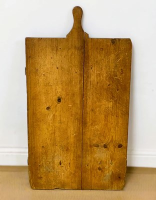 Lot 65 - A large rustic Continental pine bread cutting...