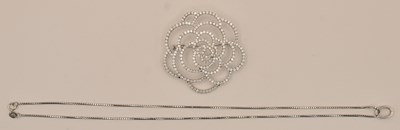Lot 1299 - An 18ct white gold diamond set pierced floral...