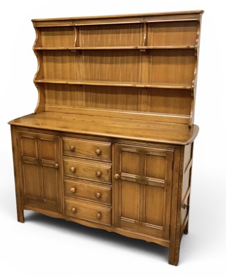 Lot 91 - ERCOL; a modern medium elm dresser, with...