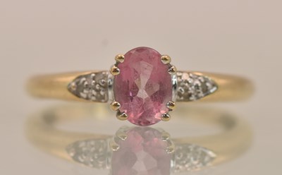 Lot 1319 - A yellow gold dress ring, with a claw set oval...