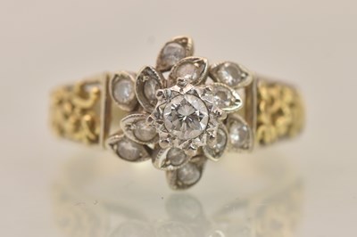 Lot 1286 - An 18ct yellow gold diamond cluster ring, the...